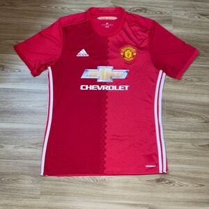 Red Adidas Manchester United Jersey With Stripes down the side. Good Condition.